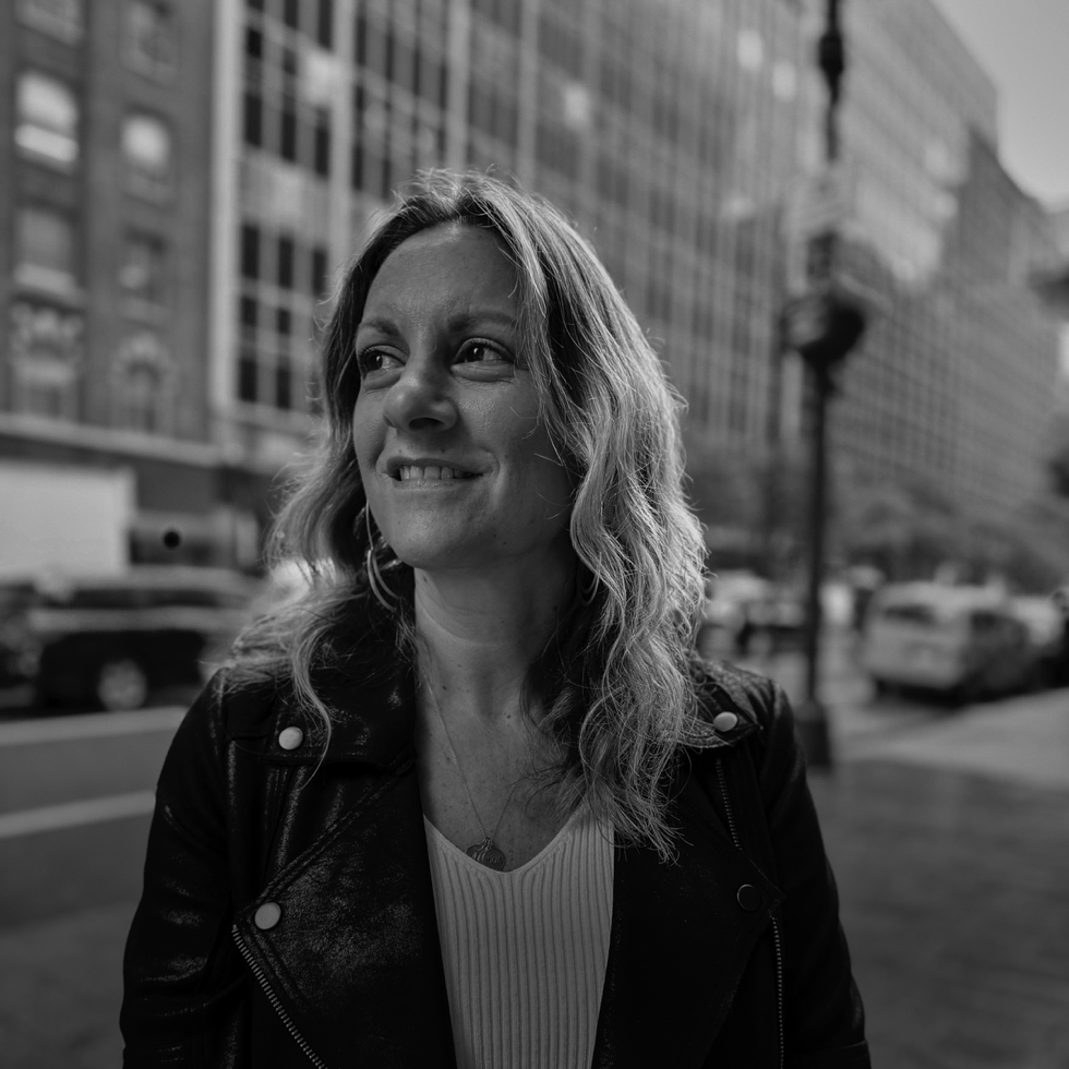 A black and white image of Cara Lewis, CIO of Dentsu