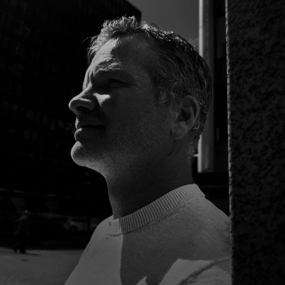  A black and white image of Jeremy Carey, CIO of Optimum Sports